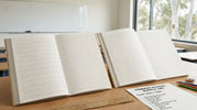 Australian exercise books showing different writing rulings including dotted thirds and narrow ruled lines