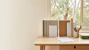 Australian school notebooks, exercise books and copy paper on a study desk