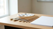 Paint brushes in different sizes arranged with a paint palette for Australian school art activities